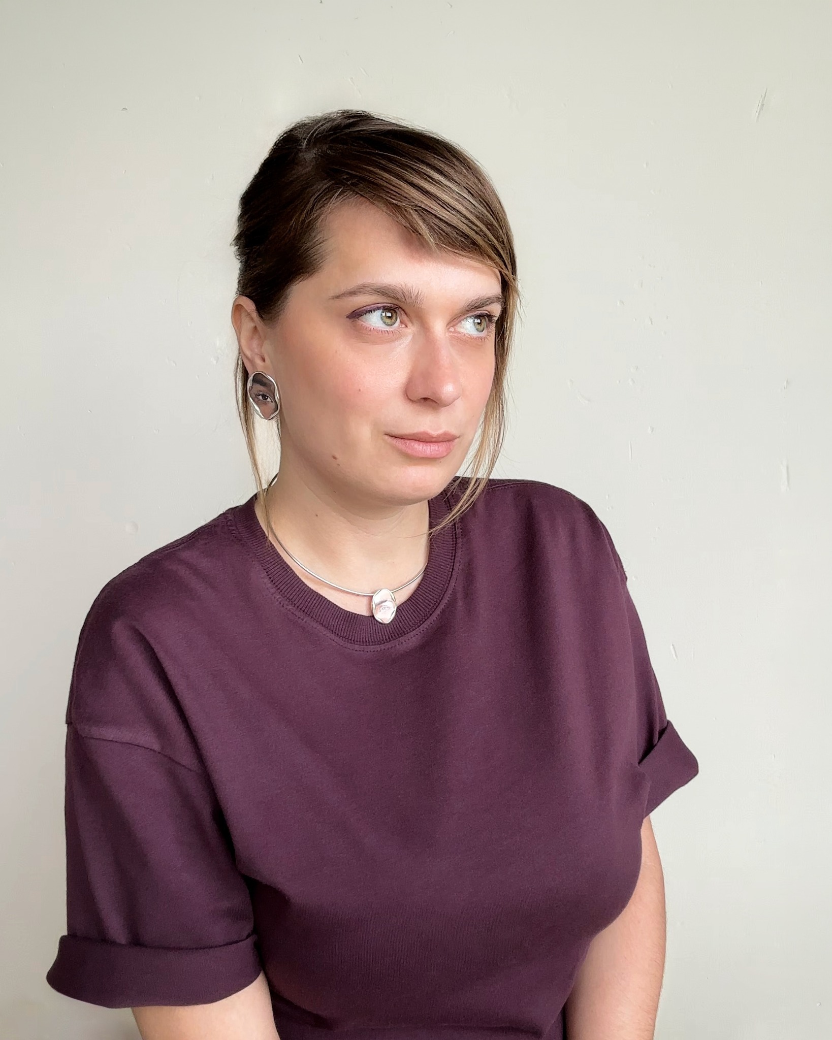 Ewelina Klimik wearing her eye portrait jewellery