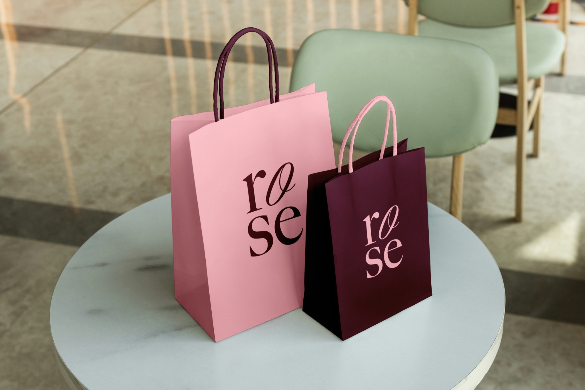 Pink and burgundy shopping bags with oversized ROSE typography