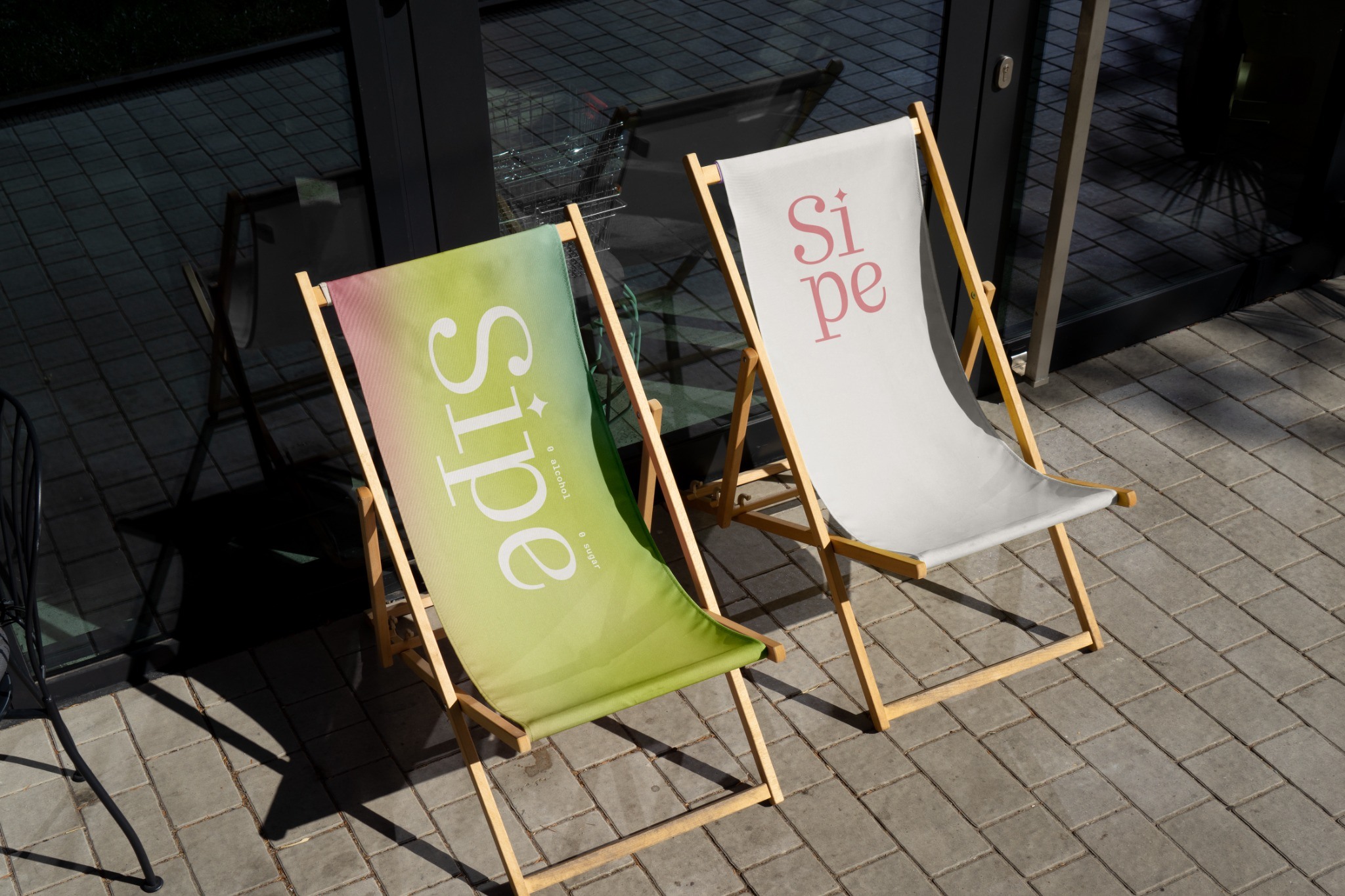 SIPE typography on green and cream deckchairs in strong sunlight