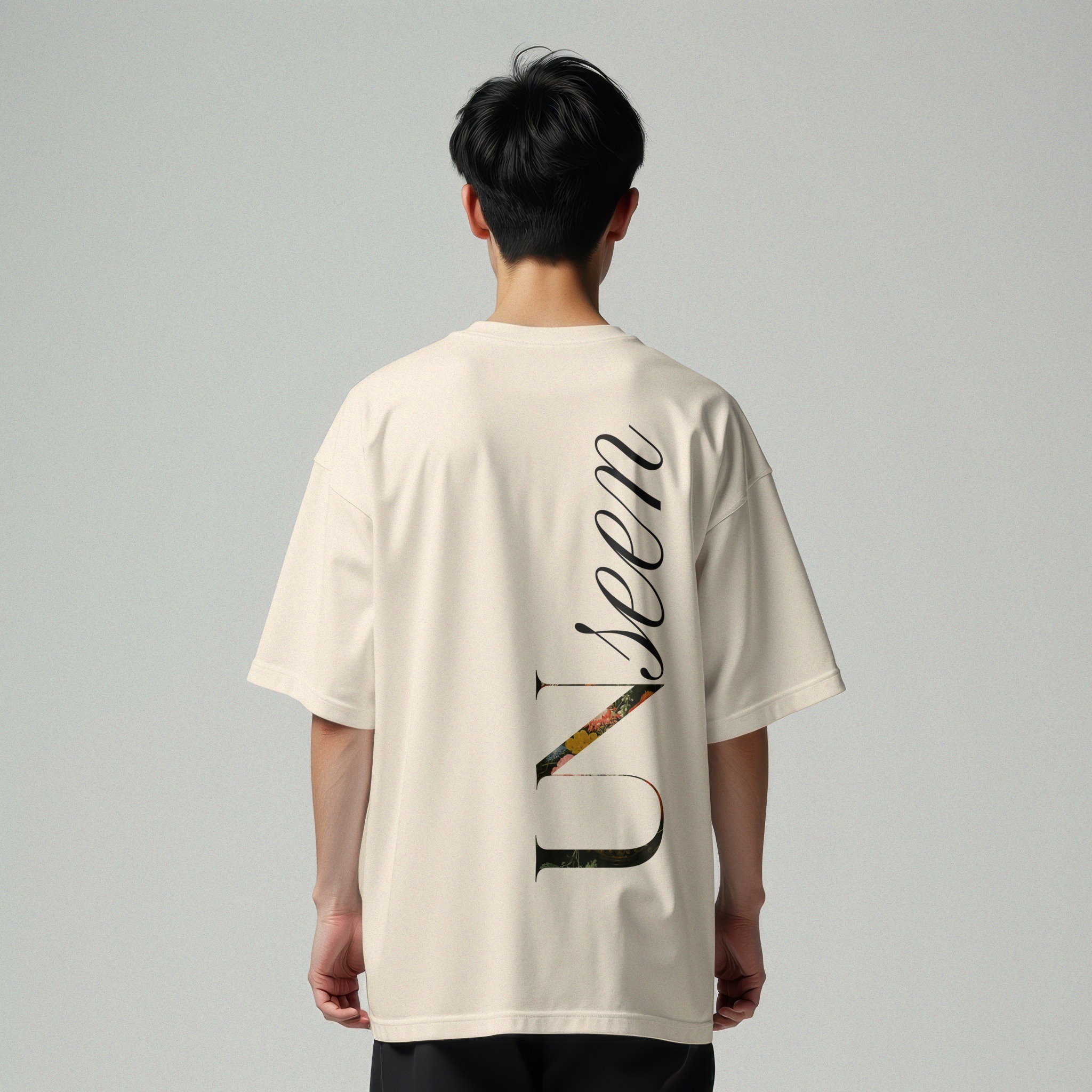 Light T-shirt with large vertical typography on the back