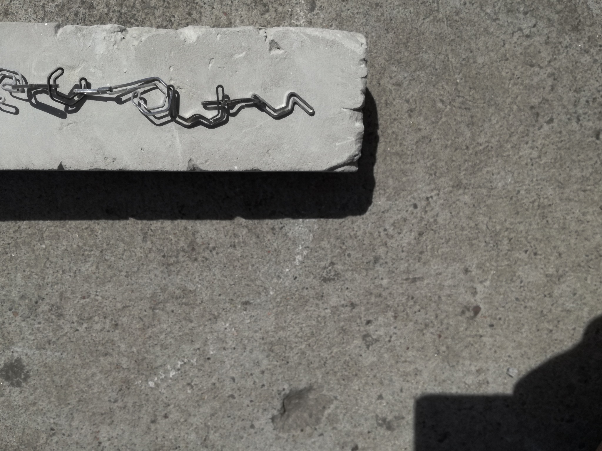Detail of connected silver profiles and their shadows