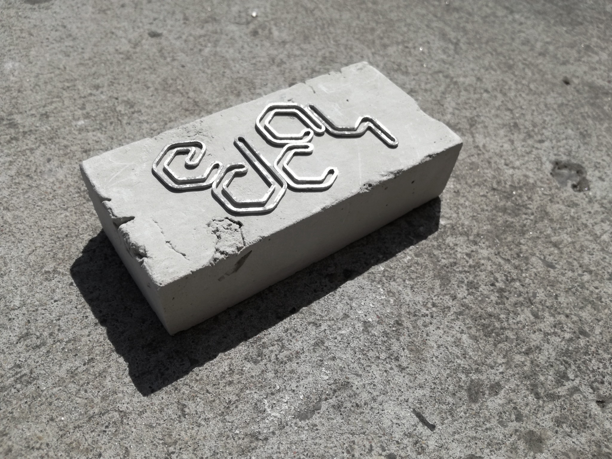 Geometric silver modules arranged on concrete