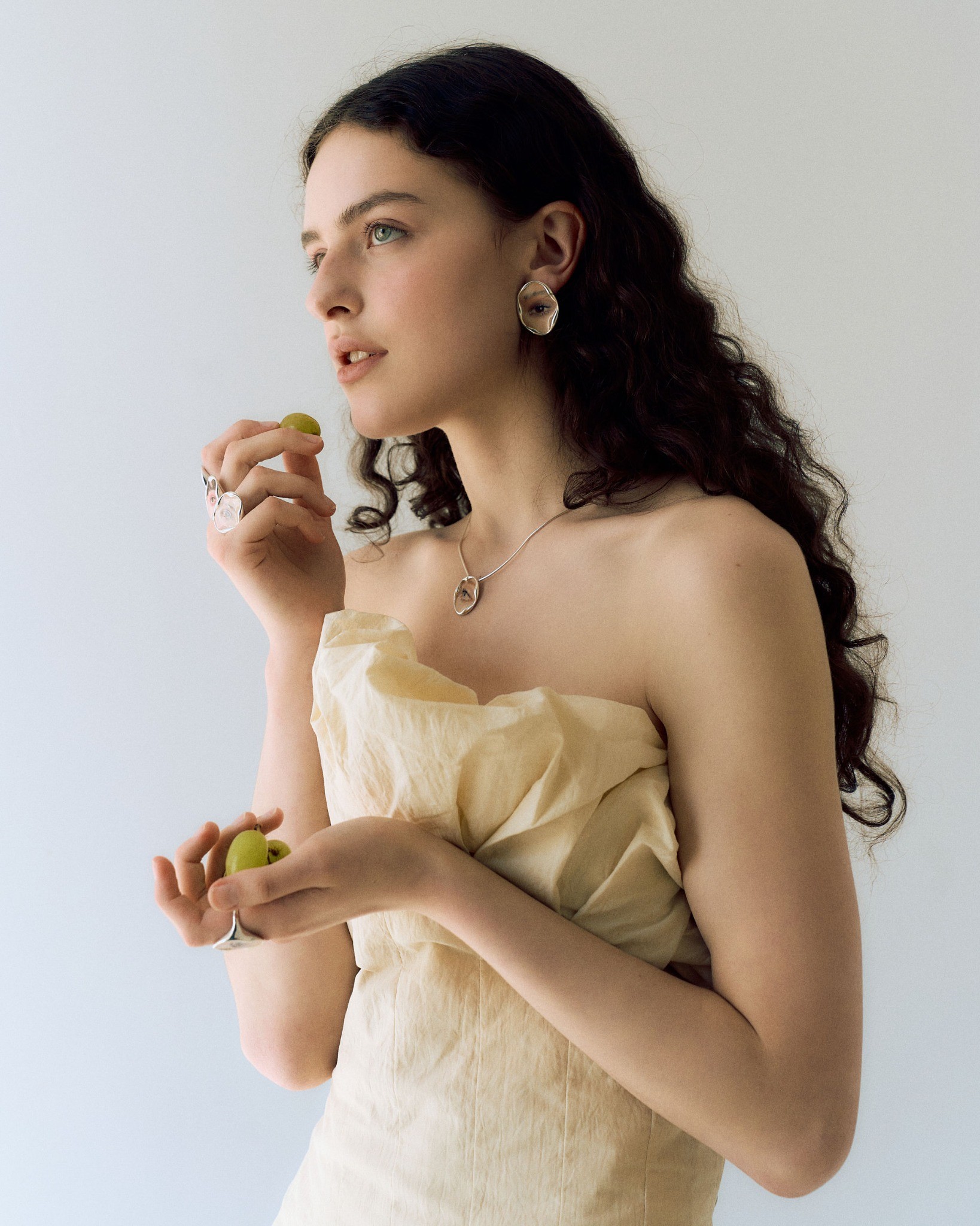 Campaign portrait holding green grapes