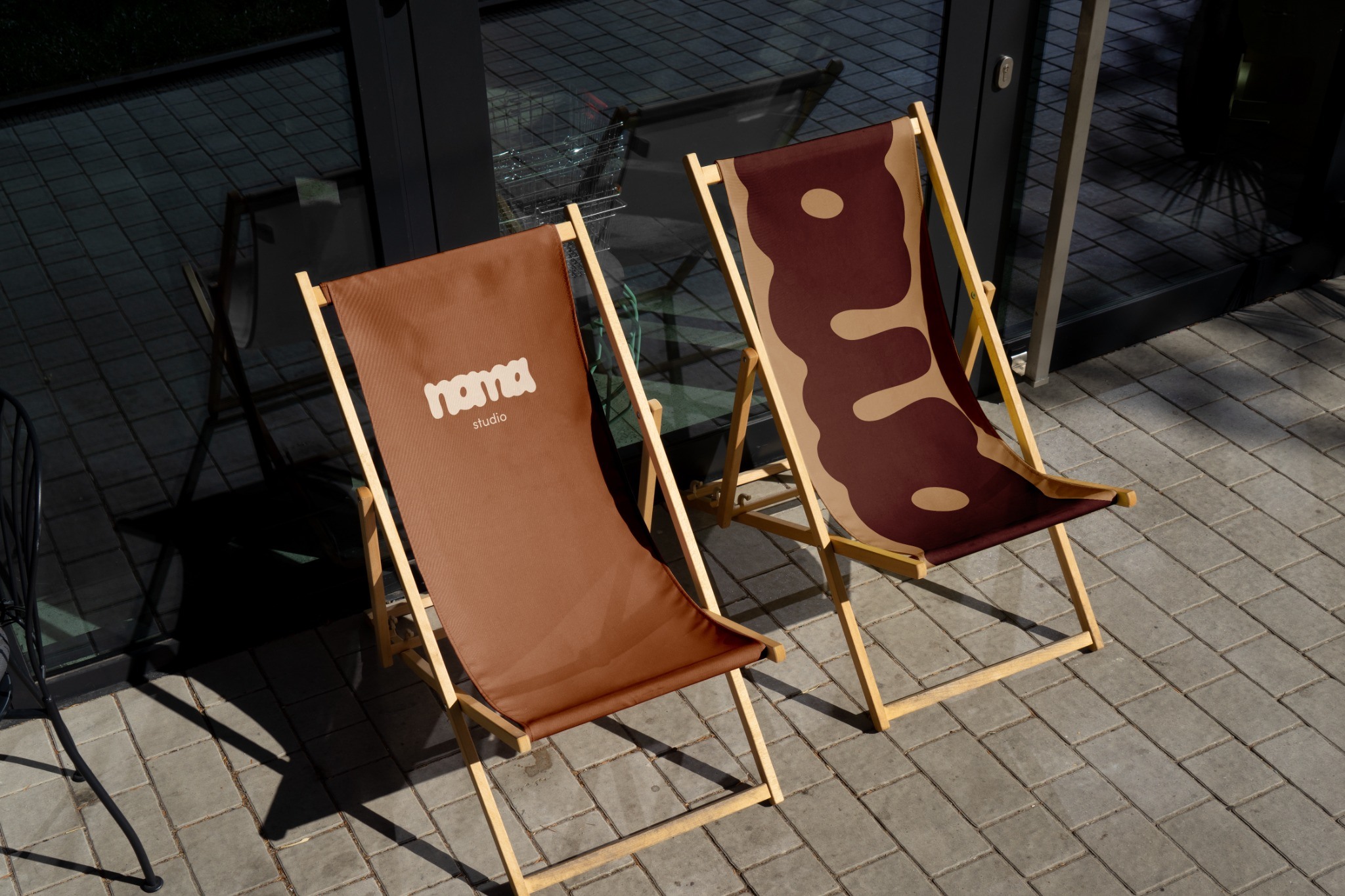 Abstract cream shapes on a burgundy deckchair