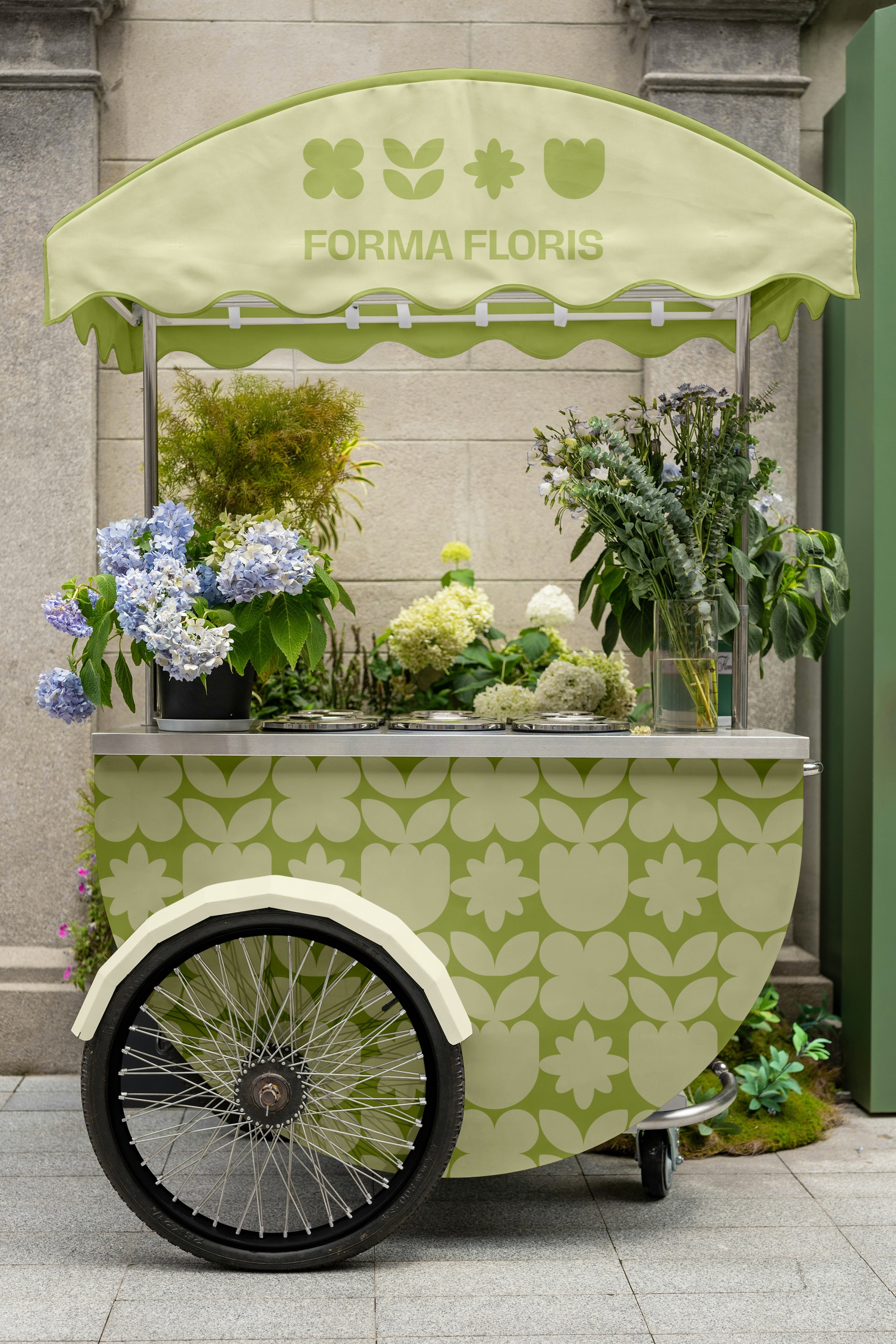 Botanical motifs repeated across a green flower cart