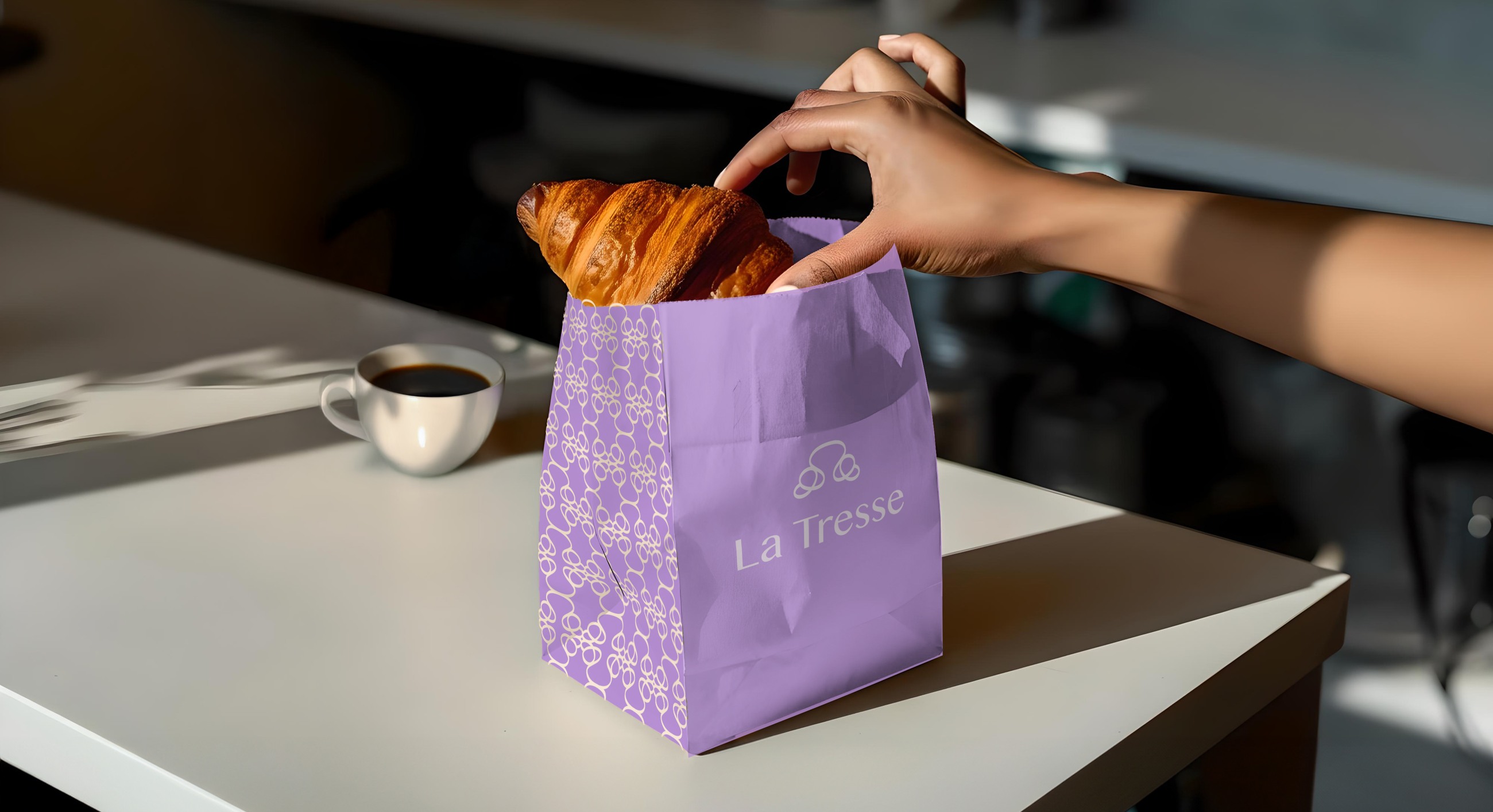 La Tresse ornament applied to a lilac paper bag